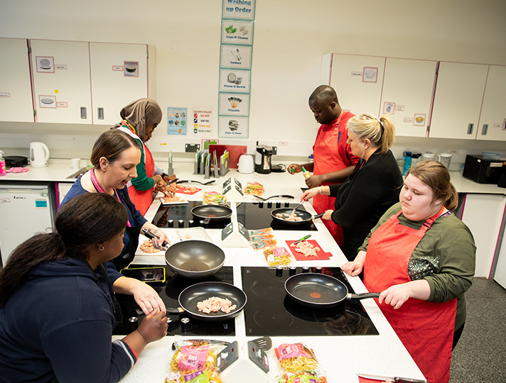 Students learning to cook